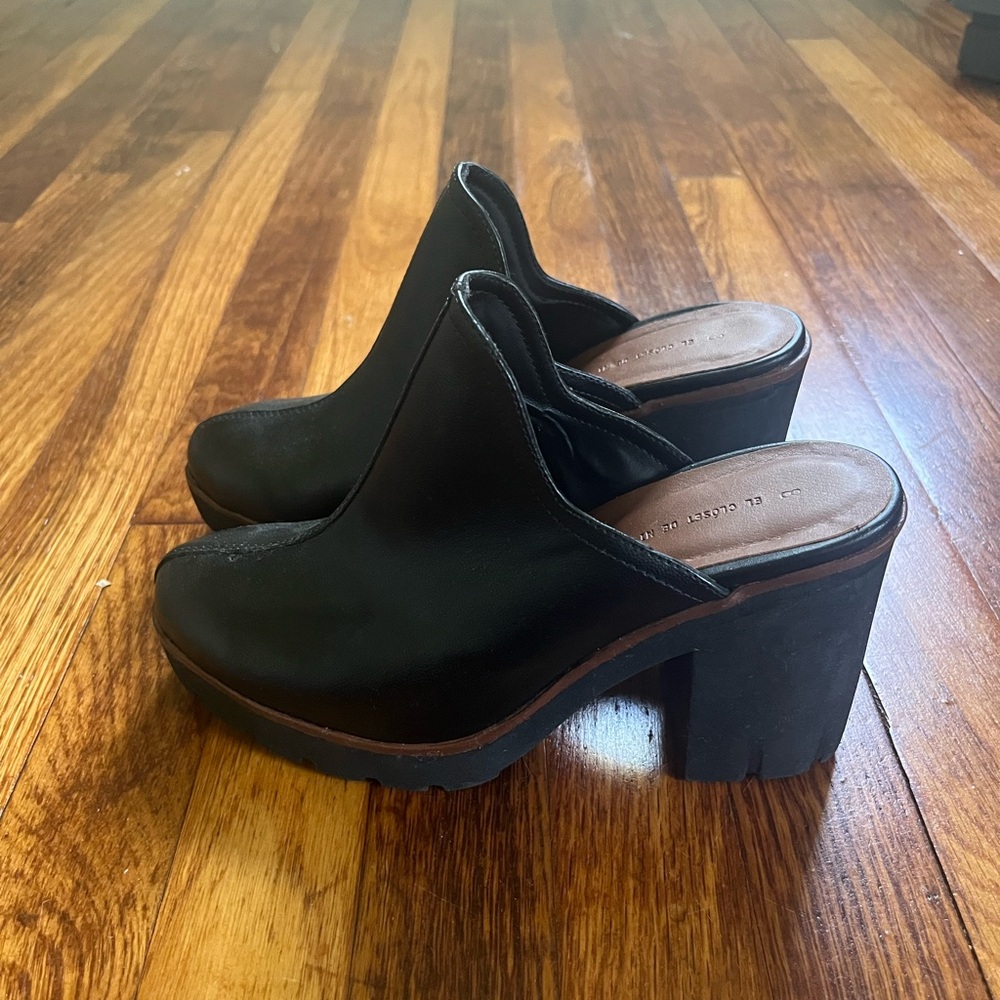 High heeled black leather clogs